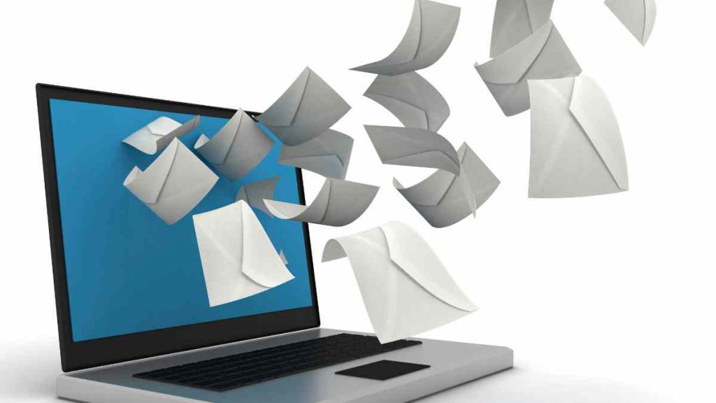 Animated envelopes coming out of a laptop screen representing email campaigns managed by an email marketing agency.