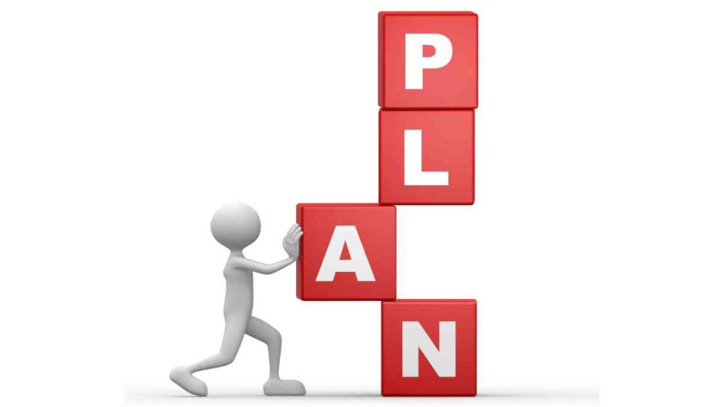 3D illustration of a figure stacking red blocks with the letters P, L, A, N to form the word 'PLAN'